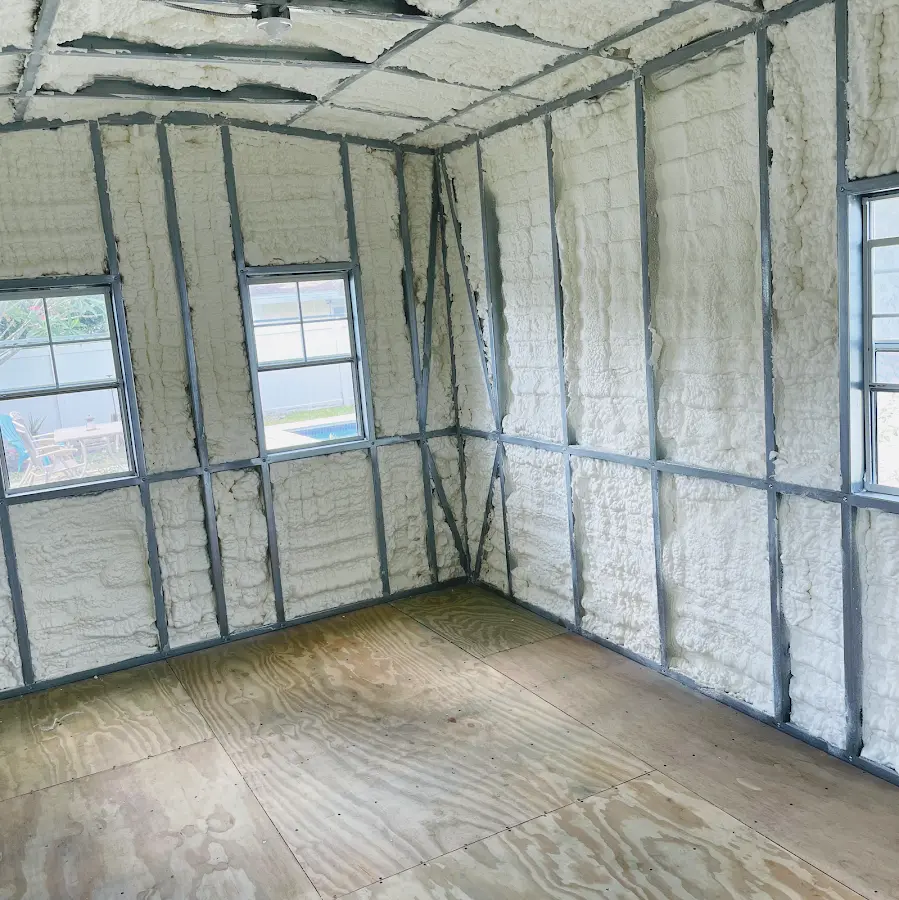 Closed-cell spray foam insulation applied to wall cavities in a residential project in Kansas City